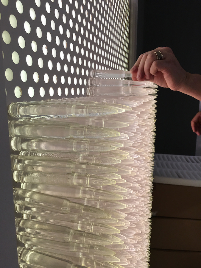 Pandora 2016; LED lightbox within doorframe; clear cast resin 50. cal Browning bullets; installation view, Akbank Sanat, Istanbul 2018 Pandora 2016; LED lightbox within doorframe; clear cast resin 50. cal Browning bullets; installation view, Akbank Sanat, Istanbul 2018